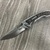 CRKY FOSSIL FOLDING BLADE KNIFE 
